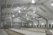 Interior of a metal building, white with lighting on the ceiling
